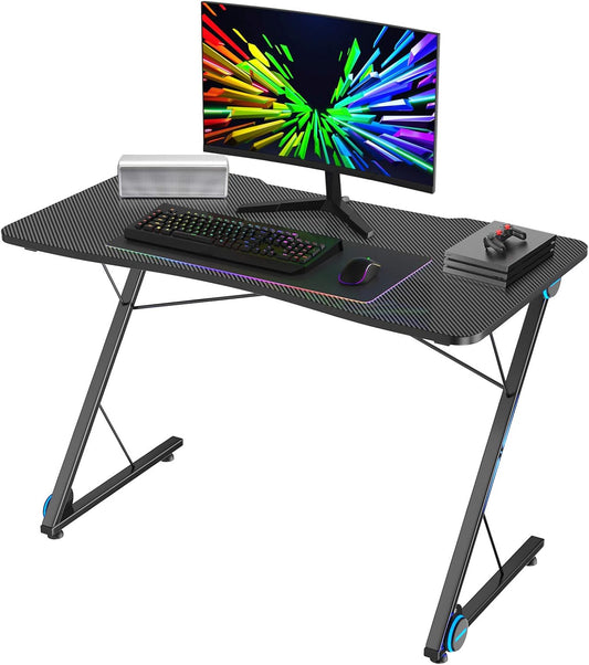 Tangkula Gaming Computer Desk, Z-Shaped Home Office Computer Table with LED Lights & Large Carbon Fiber Surface, Ergonomic Gamer Workstation, Writing Desk for Home Office